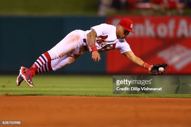 Kolten Wong of the St. Louis Cardinals fields a ground ball for the final out against the Kansas City Royals in the ninth inning at Busch Stadium on...