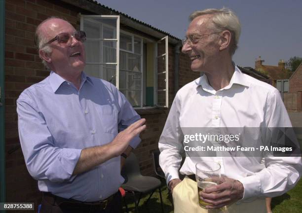 Great Train Robber Bruce Reynolds meets former police officer John Woolley at Oakley Village Hall, Buckinghamshire, during a village fete. Mr Woolley...