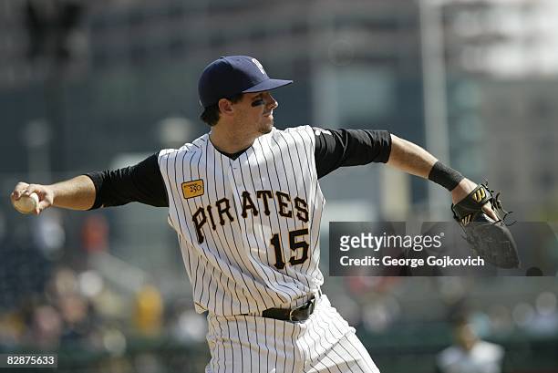 Third baseman Andy LaRoche of the Pittsburgh Pirates throws to first base while warming up between innings during a game against the St. Louis...