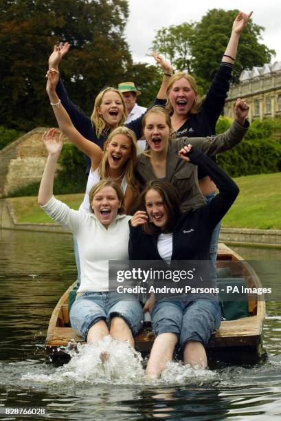 Girls From St Mary's school, Cambridge, celebrate getting their GCSE results by punting on the River Cam by King's College.