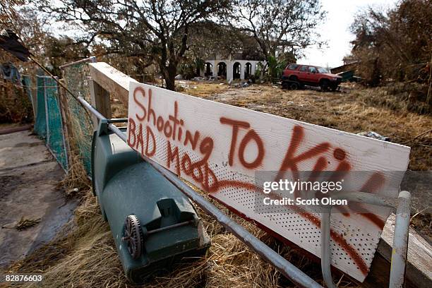 Homeowner warns away looters following Hurricane Ike September 18, 2008 in Galveston, Texas. Most of the island remains without running water,...