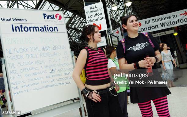 Festival goers from Melton Mowbray, Rosanna , aged 20, and her friend Chloe, aged 19, arriving at Reading railway station for the Reading Festival,...