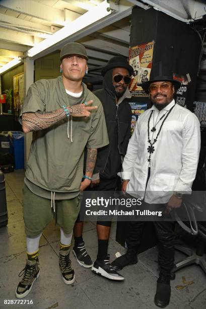 Taboo, will.i.am and apl.de.ap of The Black Eyed Peas pose backstage at an in-store signing and livestream for their new graphic novel "Masters of...