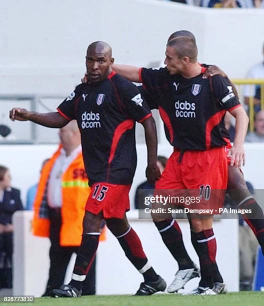 Fulham's Barry Hayles is congratulated by team mate Lee Clark after scoring against Tottenham Hotspur, during their FA Premiership match at...