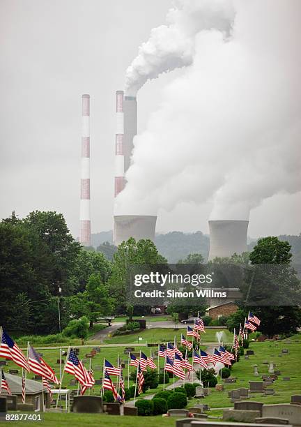 cemetary with view of homes and power plant - unfilteredtrend stock pictures, royalty-free photos & images