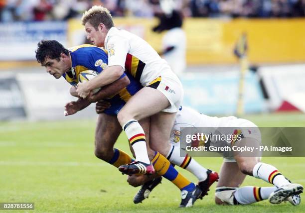 Bradford Bulls' Karl Pratt and James Lowes tackle Leeds Rhinos' Chris McKenna during their Tetley Bitter Super League game at Osdal Stadium, Bradford.