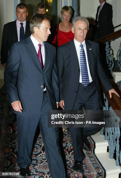 British Prime Minister Tony Blair heads for dinner with Nigel de Gruchy and the new TUC General Secretary Brendan Barber on his arrival at The Grand...
