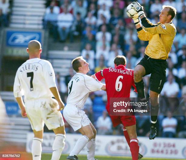 Middlesbrough goalkeeper Mark Schwarzer claims the ball ahead of Bolton Wanderers' attack during their FA Barclaycard Premiership match at the Reebok...