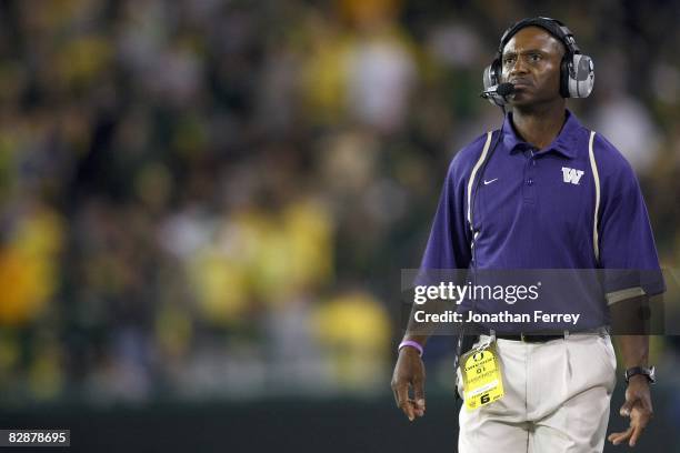 Head coach Tyrone Willingham of the Washington Huskies watches the scoreboard during the game against the Oregon Ducks at Autzen Stadium on August...