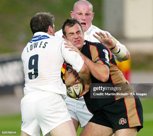 Castleford Tigers' Tom Saxton is tackled by Bradford Bulls' James Lowes and Richard Moore during the Tetley's Super League match at Odsal Stadium,...