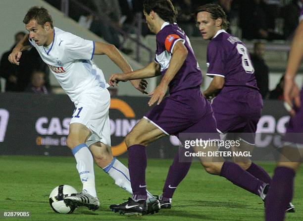 Dimitrije Injac of Lech Poznan fights for ball with Jocelyn Blanchard and Matthias Hattenberger of Austria Wien during their UEFA Cup final round...