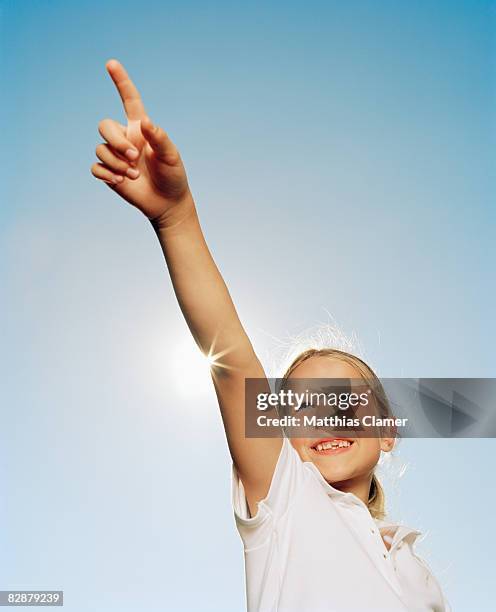 young girl points to the distance  - girl pointing bildbanksfoton och bilder