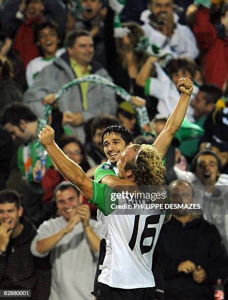 Santander's Jonathan Pereira is congratulated by his teammate Jorge Gonçalves after scoring during the UEFA Cup first round football match Racing...
