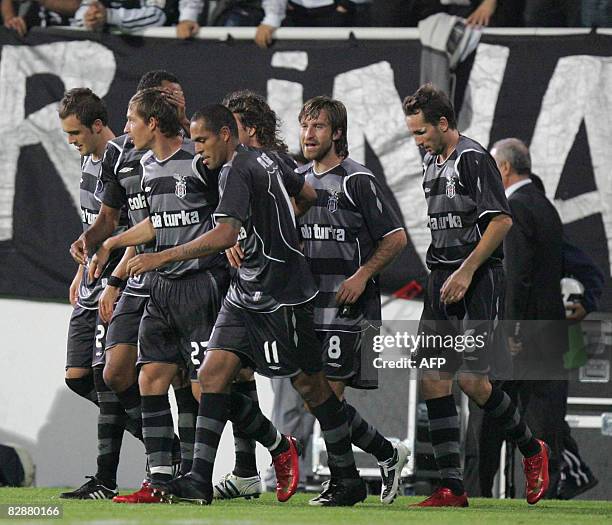 Besiktas players celebrate their goal against Metalist Kahrkiv during their UEFA Cup first round match at Inonu Stadium in Istanbul, on September 18,...