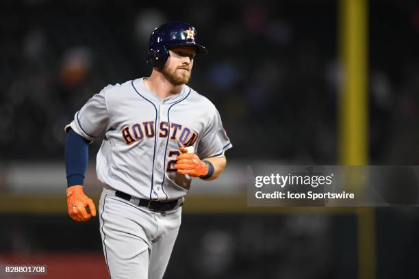 Houston Astros left fielder Derek Fisher rounds the bases after hitting a home run in the eighth inning during a game between the Houston Astros and...