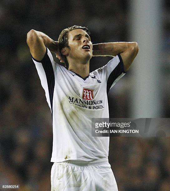 Tottenham's David Bentley reacts after taking a free kick against Wisla Krakow during their UEFA Cup first round first leg football match on...
