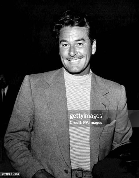 Actor Errol Flynn at London's Heathrow Airport after returning from Rome, Italy.