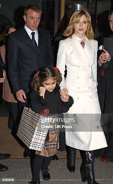 Madonna , her daughter Lourdes, and husband Guy Ritchie arrive at the opening of the Mario Testino photography exhibition January 29, 2002 at the...