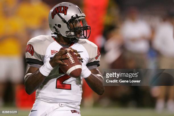Quarterback Omar Clayton of the UNLV Rebels looks for a receiver while in the pocket during a game against the Arizona State Sun Devils at Sun Devil...
