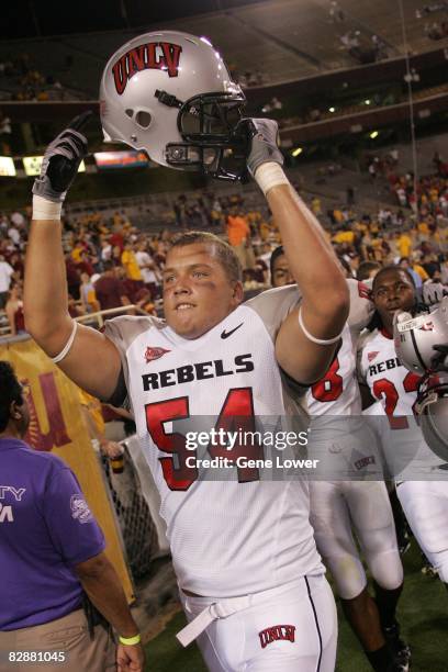 Linebacker Bryce Saldi of the UNLV Rebels celebrates an overtime win against the Arizona State Sun Devils at Sun Devil Stadium in Tempe, Arizona on...