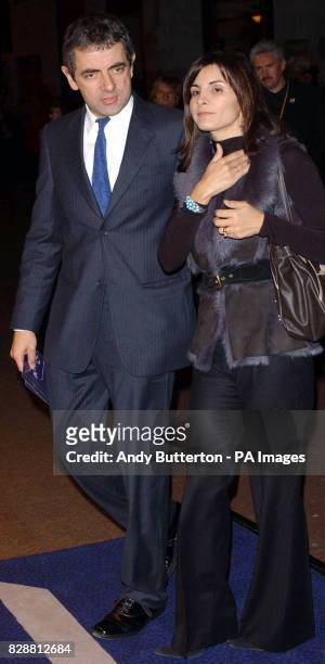 Rowan Atkinson arrives with his wife Sunetra for the DVD screening of "A Concert For George" at Odeon West End in central London. The DVD features a...