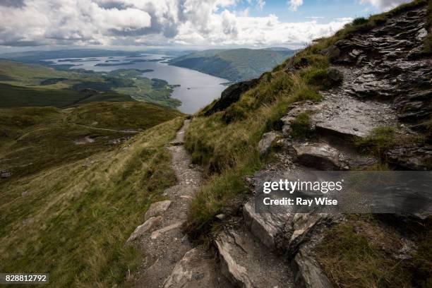 steps leading down a mountain to a distant lake - ben lomond stock pictures, royalty-free photos & images