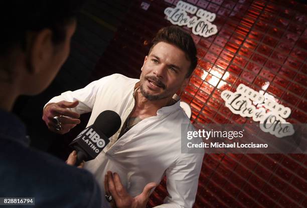 Singer Pedro Capo is interviewed during HBO Latino x Pedro Capo: En Letra de Otro at La Marina Restaurant Bar Beach Lounge on August 9, 2017 in New...