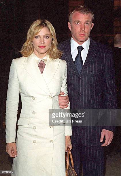 Madonna and husband Guy Ritchie arrive at the opening of the Mario Testino photography exhibition January 29, 2002 at the National Portrait Gallery...