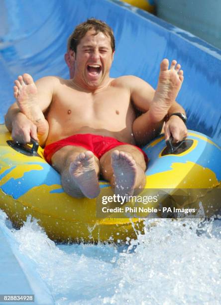 England rugby player Andy Gomarsall slides down a water chute during a team trip to the 'Wet and Wild' water park near Brisbane's Gold Coast. England...