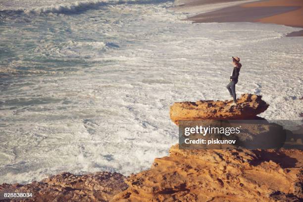 young woman on beach - piskunov imagens e fotografias de stock