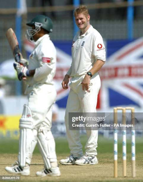 England bowler Matthew Hoggard smiles at Bangladesh captain Khaled Mahmud during their encounter on the wicket, in the morning session of the third...