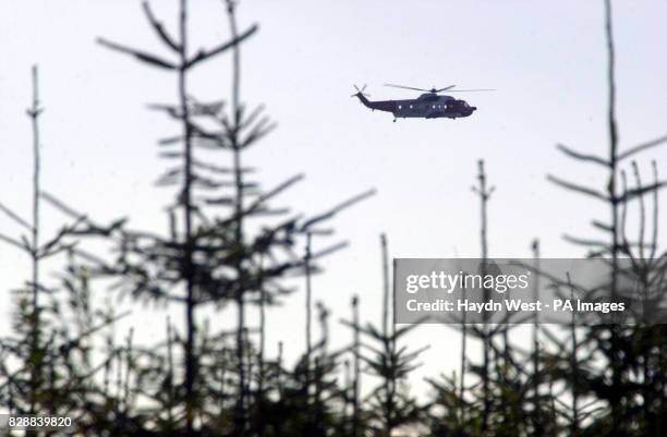 An air, sea rescue helicopter views fles over a river of sludge from works at a wind farm above Derrybrien, Co Galway, Ireland, in the latter stages...