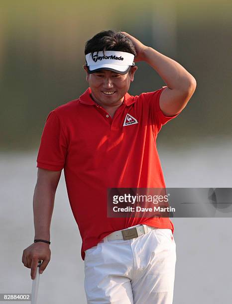 Yang of South Korea scratches his head on the 9th green as he completes his first round play in the Viking Classic at the Annandale Golf Club on...