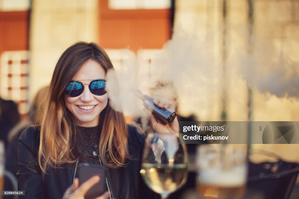 Woman with electronic cigarette