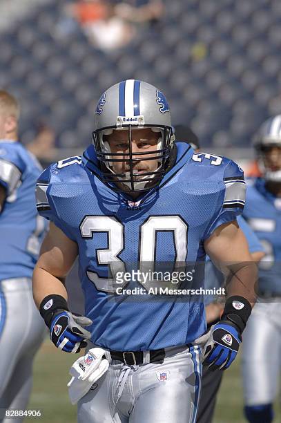 Detroit Lions fullback Corey Schlesinger warms up before a game between the Chicago Bears and Detroit Lions at Soldier Field in Chicago, Illinois on...