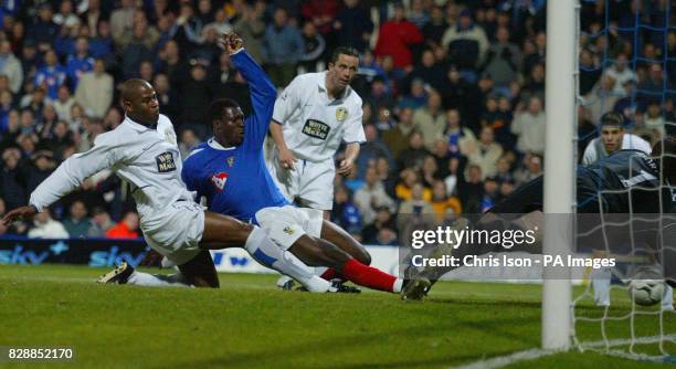 Ayegbeni Yakubu of Portsmouth FC puts the final nail in Leeds United's coffin as he slips Pompey's sixth into Paul Robinson's net, during their...