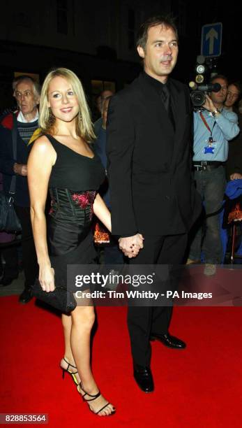 Presenter Abi Titmuss and boyfriend John Leslie arrive for the premiere of Jerry Springer - The Opera at the Cambridge Theatre in central London. The...