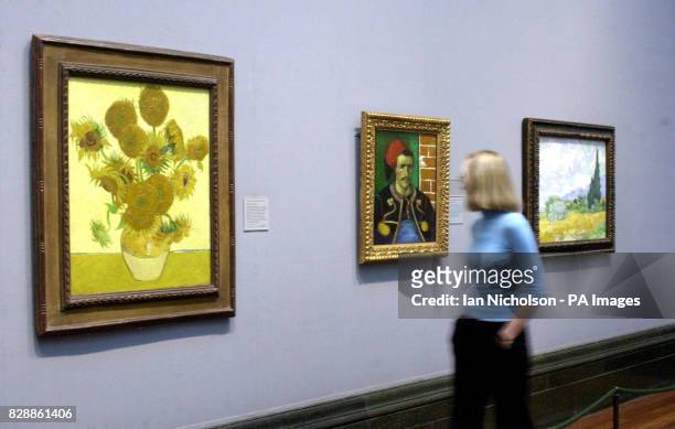 Passer by views 'The Zouave', one of a series of portraits by Van Gogh painted in Arles, on display at London's National Gallery. The Zouaves were a...