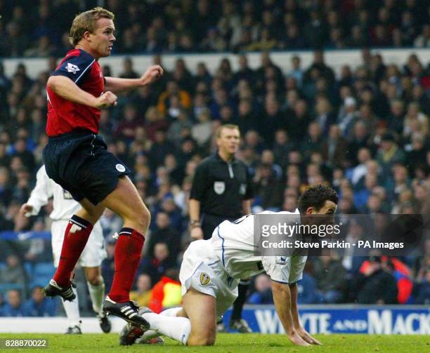 Bolton Wanderers' Kevin Davies scores the opening goal as Leeds United defender Ian Harte looks on during their FA Barclaycard Premiership match at...