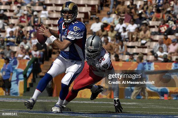 St. Louis Rams quarterback Marc Bulger doges the pass rush during the NFL Pro Bowl game at Aloha Stadium in Honolulu, Hawaii on February 10, 2007