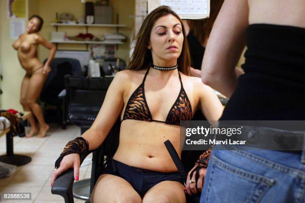 Exotic dancer, Chassity Star prepares to go onstage at the Hustler Club on October 1, 2004 in New York City. The club is owned by Larry Flynt who is...