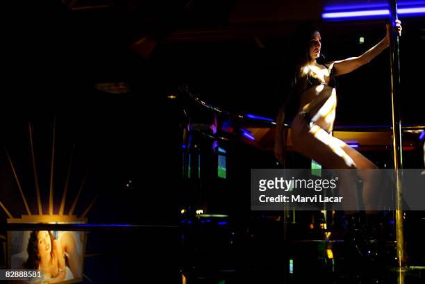 Exotic dancer, Chassity Star practices her routine before taking center stage at the Hustler Club on October 1, 2004 in New York City. The club is...