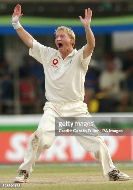 England's Gareth Batty appeals for and takes the wicket of Hashan Tillakaratne of Sri Lanka, at the Galle International Stadium on the third day of...