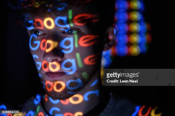 In this photo illustration, The Google logo is projected onto a man on August 09, 2017 in London, England. Founded in 1995 by Sergey Brin and Larry...