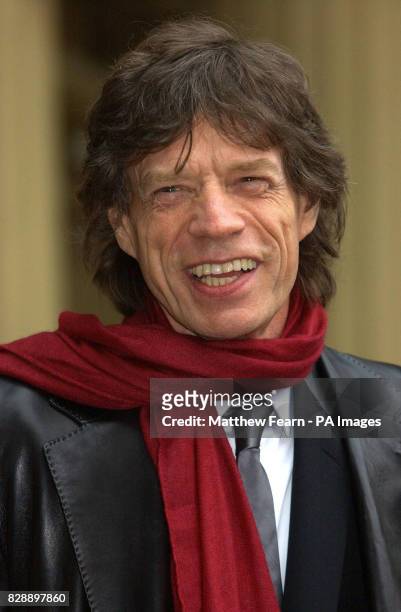 Rolling Stone Sir Mick Jagger after he received his Knighthood for services to popular music, during a ceremony held at Buckingham Palace, by the...