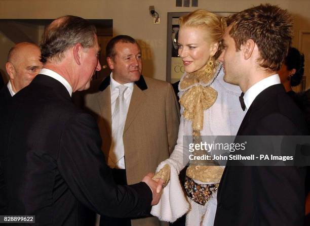 The Prince of Wales greets Nicole Kidman and Jude Law as he arrives for the Royal European Charity Premiere of Anthony Minghella's Cold Mountain at...