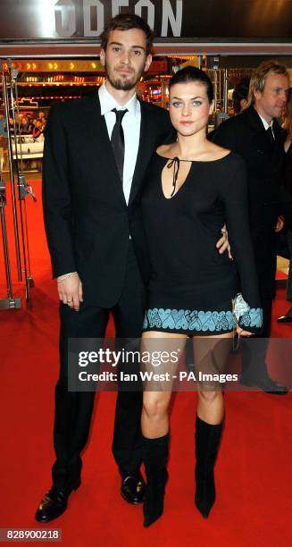 Jude Law's personal assistant Ben Jackson and Sadie Frost's sister Holly Davidson arrive for the Royal European Charity Premiere of Anthony...