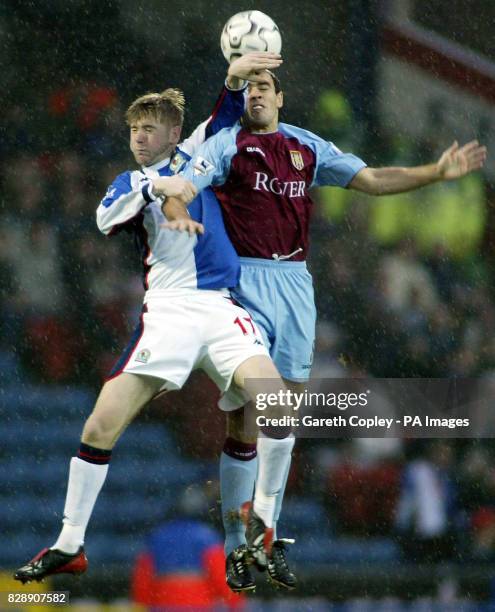 Blackburn's Paul Gallagher is beaten for the ball by Aston Villa's Gavin McCann during their Barclaycard Premiership match at Ewood Park, Blackburn....