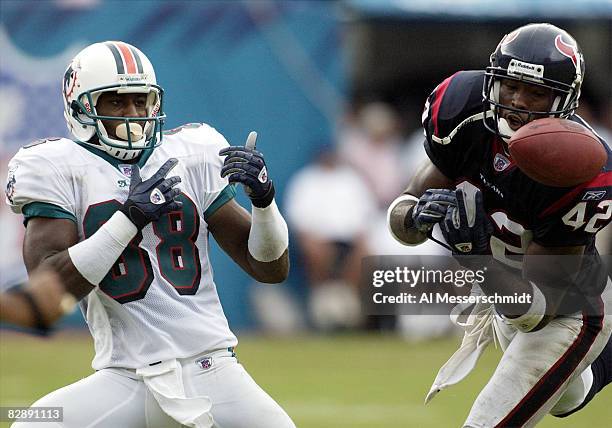 Houston Texans cornerback Marcus Coleman steps in front of Miami Dolphins wide receiver Derrius Thompson for a key interception with seconds...