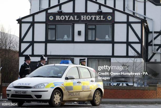 Police stand guard outside the Royal Hotel in Dunston, Gateshead, where a man was arrested in connection with the murder of Pc Ian Broadhurst and the...